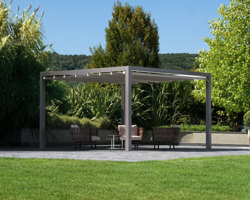 Modern outdoor aluminium pergola with lounge chairs in a landscaped garden setting