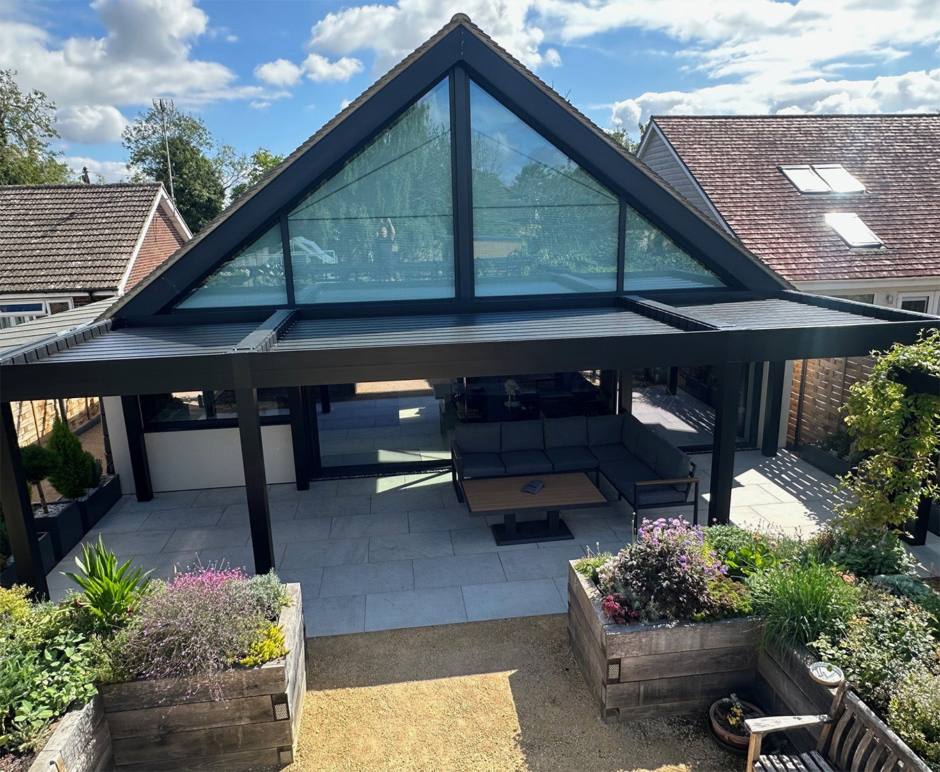 Modern luxury pergola with louvered roof and aluminium frame over outdoor seating area